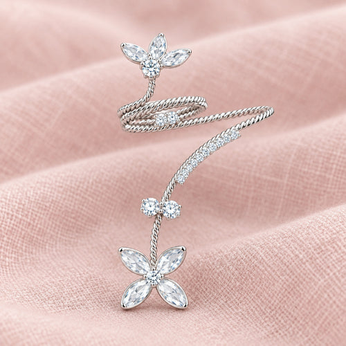 A silver-toned floral chain necklace featuring three flower motifs adorned with marquise and round clear crystals, displayed on a clean white background.