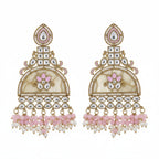 A pair of traditional Indian jhumka earrings with silver-toned metalwork, pink floral embroidery, and dangling pink and white bead tassels, displayed on a textured off-white fabric background.